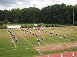 Free Stock Photo: A high school football team warming up before a game