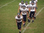 Free Stock Photo: A high school football team warming up before a game