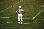Free Stock Photo: A football referee standing on an empty football field
