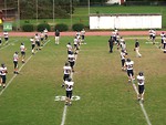 Free Stock Photo: A high school football team warming up before a game