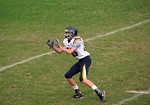 Free Stock Photo: A high school football player preparing to make a catch