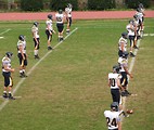 Free Stock Photo: A high school football team warming up before a game