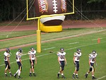 Free Stock Photo: High school football players warming up before a game