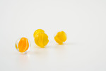 Free Stock Photo: Yellow marbles isolated on a white background